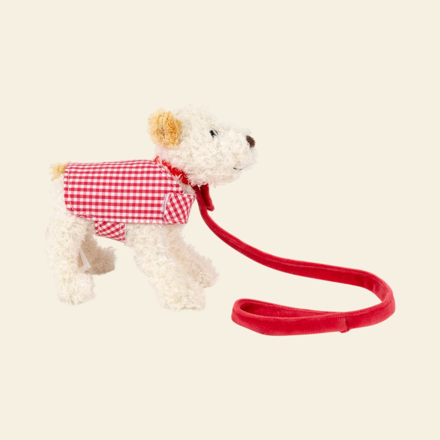 Peluche Eliot con bastone di Egmont Toys, morbido e colorato, posato nel cestino, ideale come giocattolo per bambini.