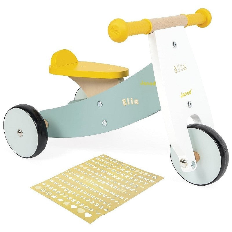 Triciclo senza pedali Janod Happy Garden in legno multicolore per bambini dai 12 mesi, con manubrio e ruote robuste.